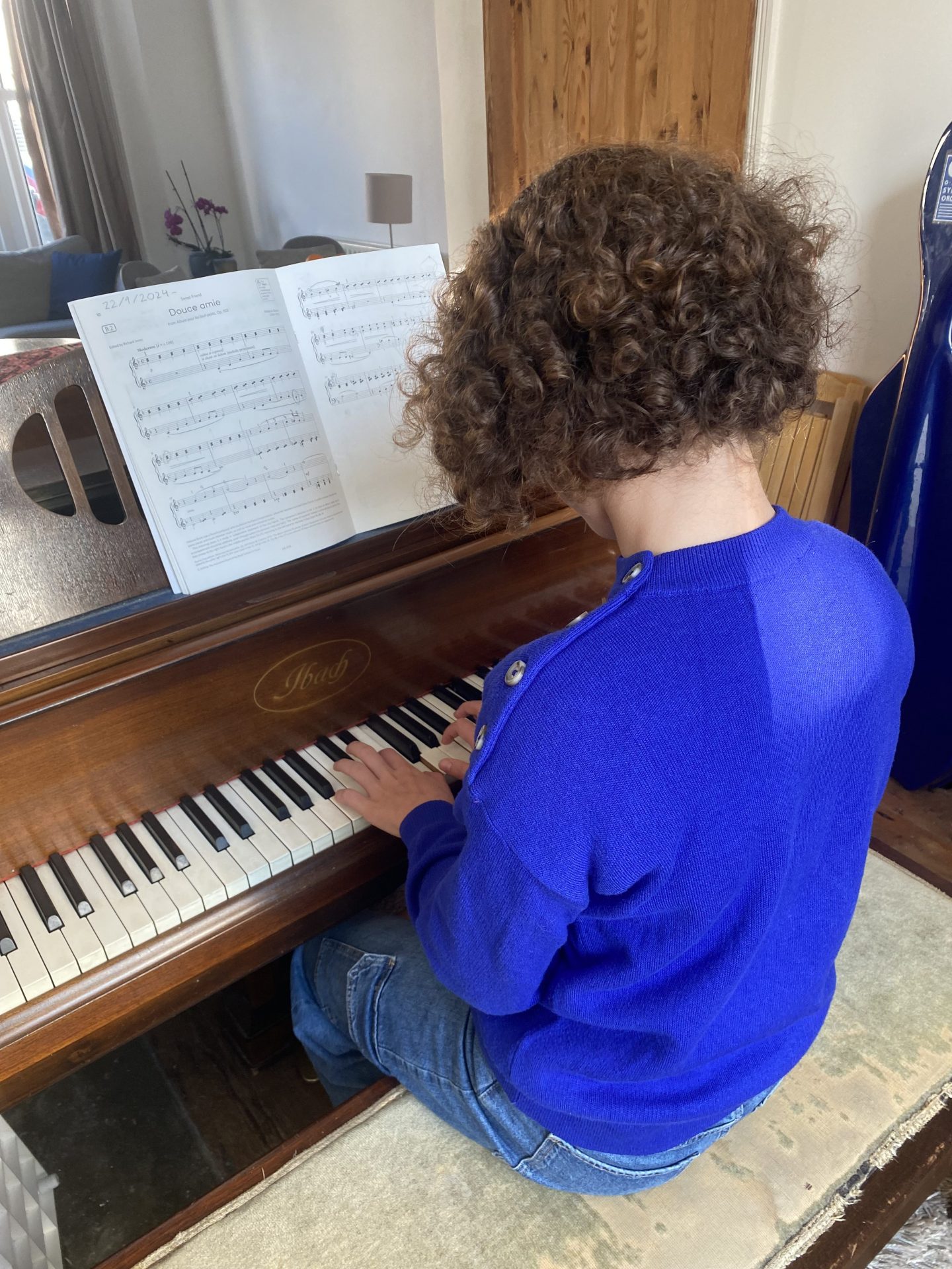 Pupil playing her ABRSM piano exam piece