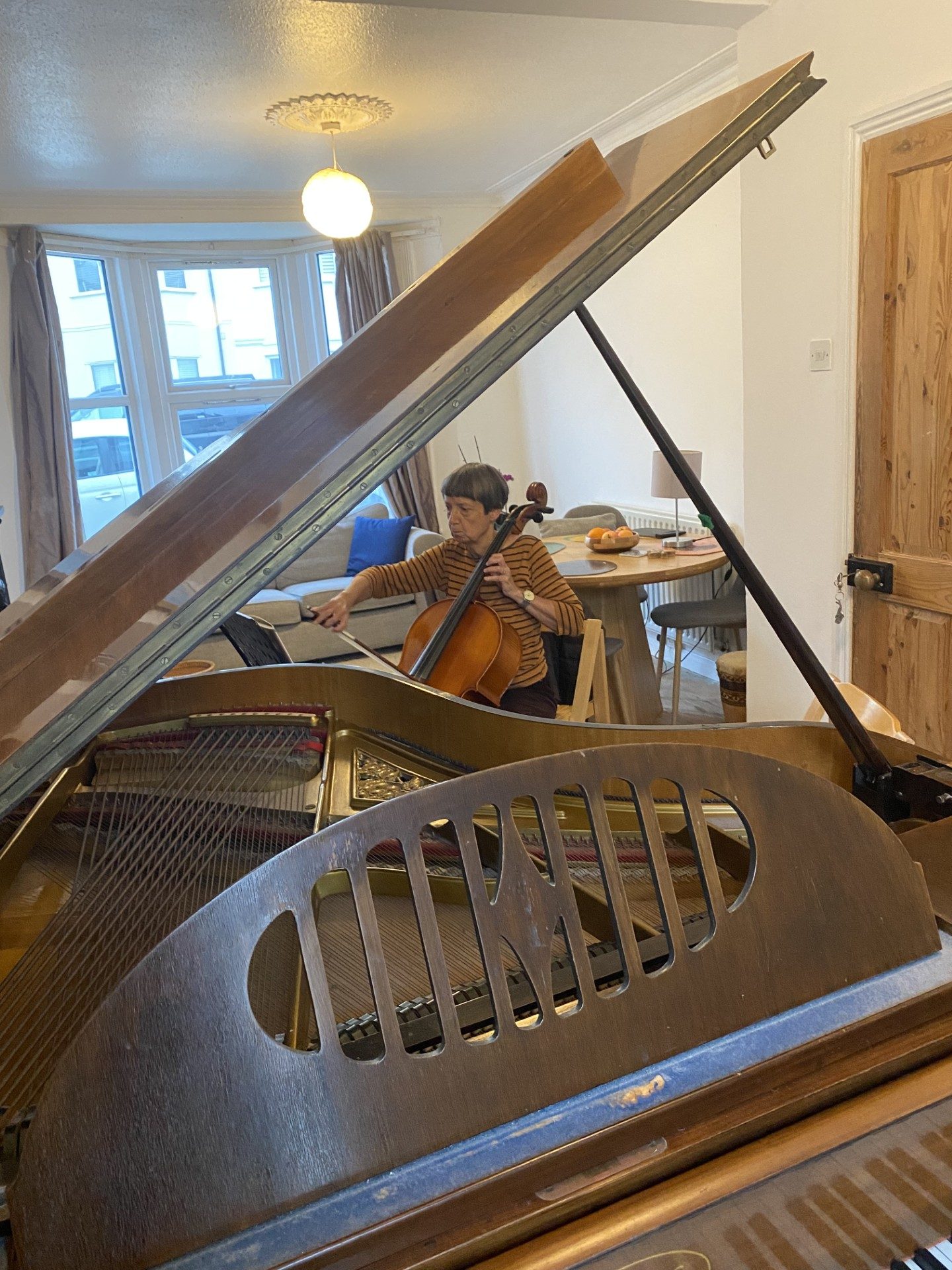 Adult cello student playing a duet